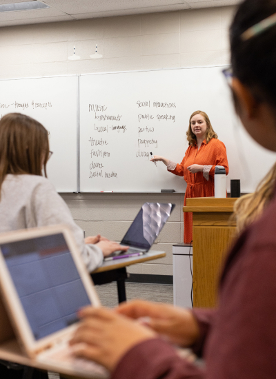 A KU faculty member teaches students in a classroom as they follow along on their laptops. A KU faculty member teaches students in a classroom as they follow along on their laptops.